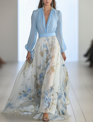 Light blue Audrey maxi dress by THE WHITMORE FAMILY featuring a vibrant floral print, flowing fabric, and elegant design.