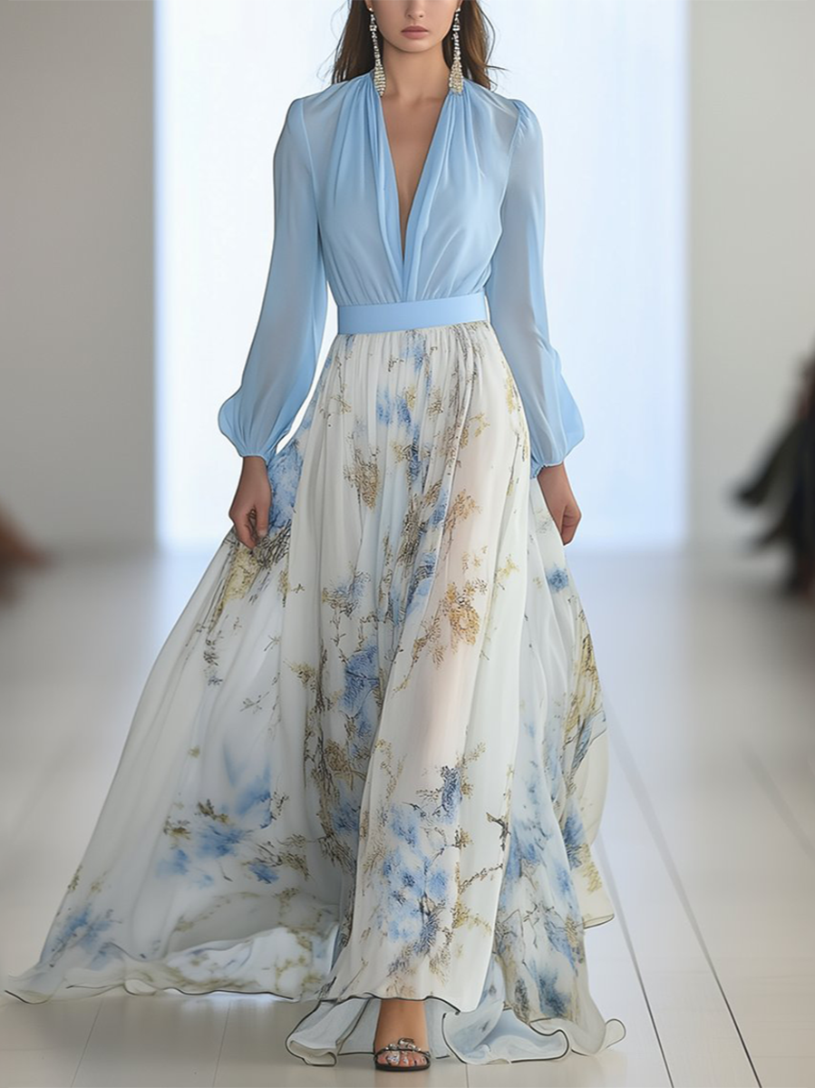 Light blue Audrey maxi dress by THE WHITMORE FAMILY featuring a vibrant floral print, flowing fabric, and elegant design.