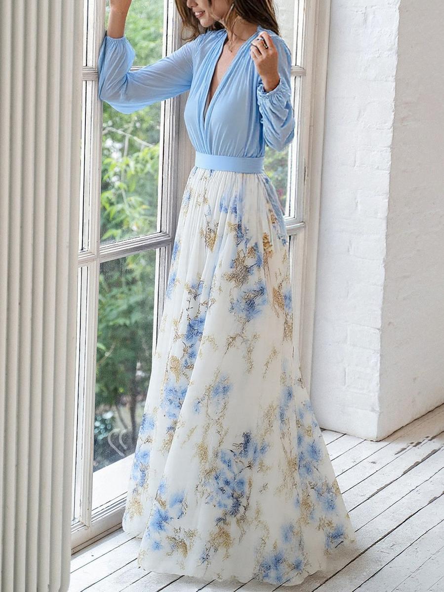 Light blue Audrey maxi dress by THE WHITMORE FAMILY featuring a vibrant floral print, flowing fabric, and elegant design.