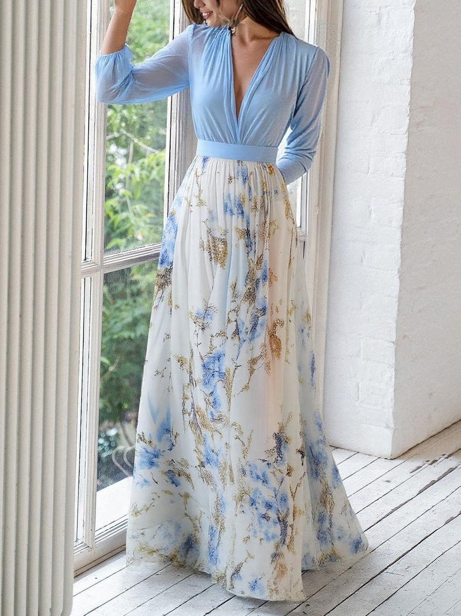 Light blue Audrey maxi dress by THE WHITMORE FAMILY featuring a vibrant floral print, flowing fabric, and elegant style.