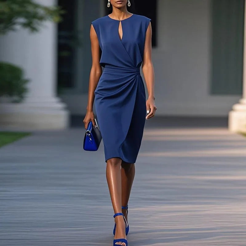 Light blue Gianna professional dress by THE WHITMORE FAMILY, displayed on a dress form, highlighting elegant design details.