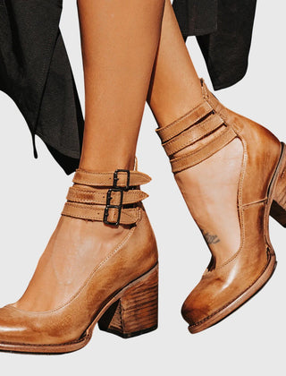Light brown Nina sandals by THE WHITMORE FAMILY, elegant and comfortable women's footwear with stylish straps and cushioned soles.
