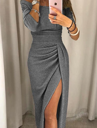 Green Audrey long dress by THE WHITMORE FAMILY featuring modern elegance and flowing fabric, perfect for stylish occasions.