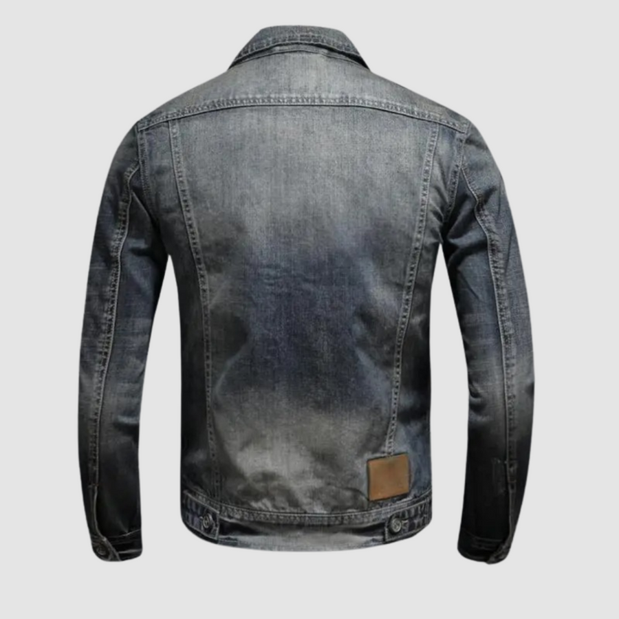 Alfred™ Classic Denim Jacket by THE WHITMORE FAMILY, showcasing a stylish blue denim jacket with button closures and chest pockets.