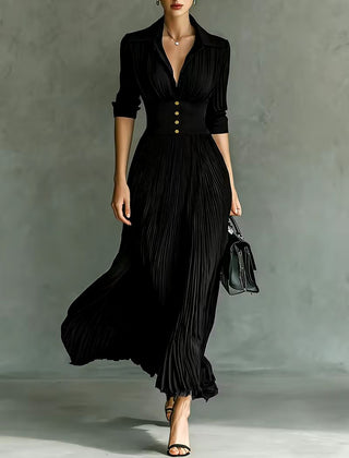 Black Joan elegant maxi dress by THE WHITMORE FAMILY, featuring flowing fabric and sophisticated design for formal occasions.