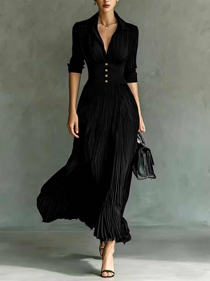 Black Joan elegant maxi dress by THE WHITMORE FAMILY, featuring flowing fabric and sophisticated design for formal occasions.