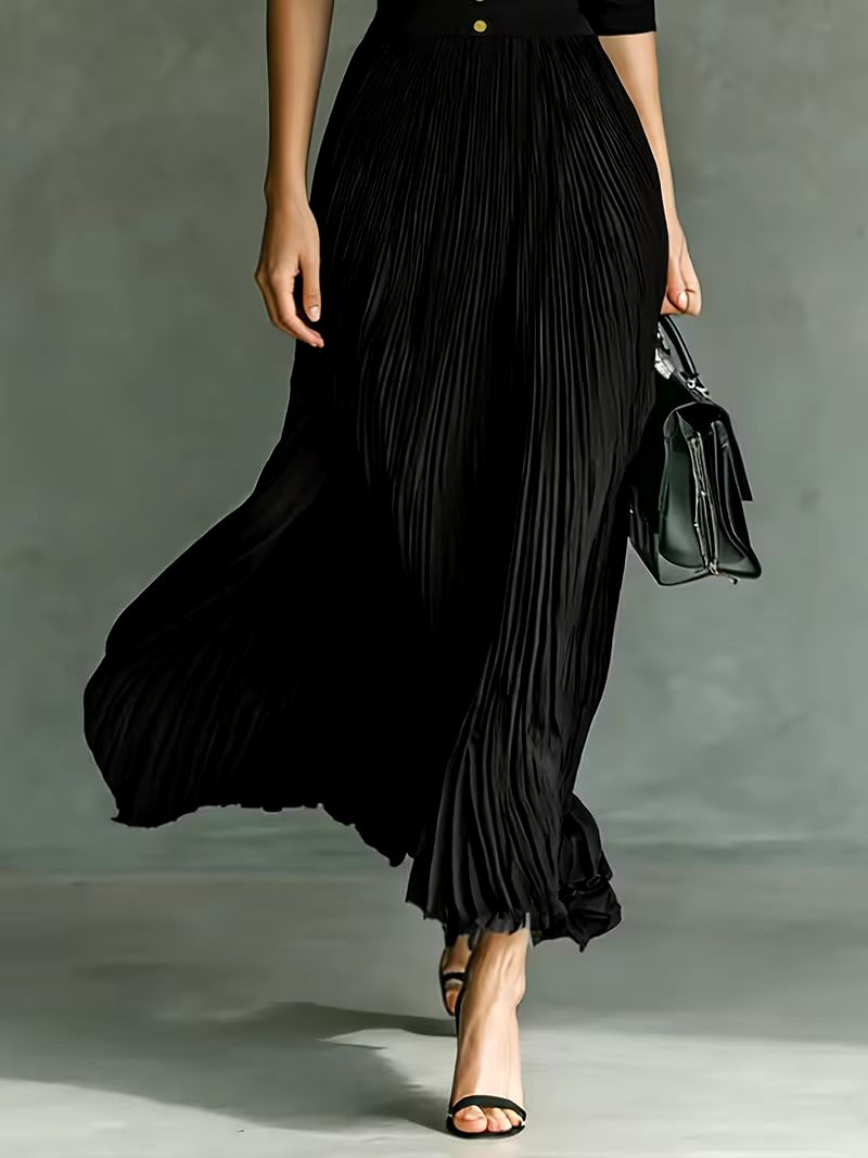 Black Joan maxi dress by THE WHITMORE FAMILY, elegant long dress with flowing fabric and stylish design, perfect for formal occasions.