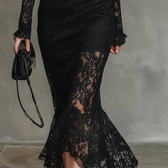Black lace maxi dress named Julia by THE WHITMORE FAMILY, featuring elegant lace fabric and a flowing silhouette.