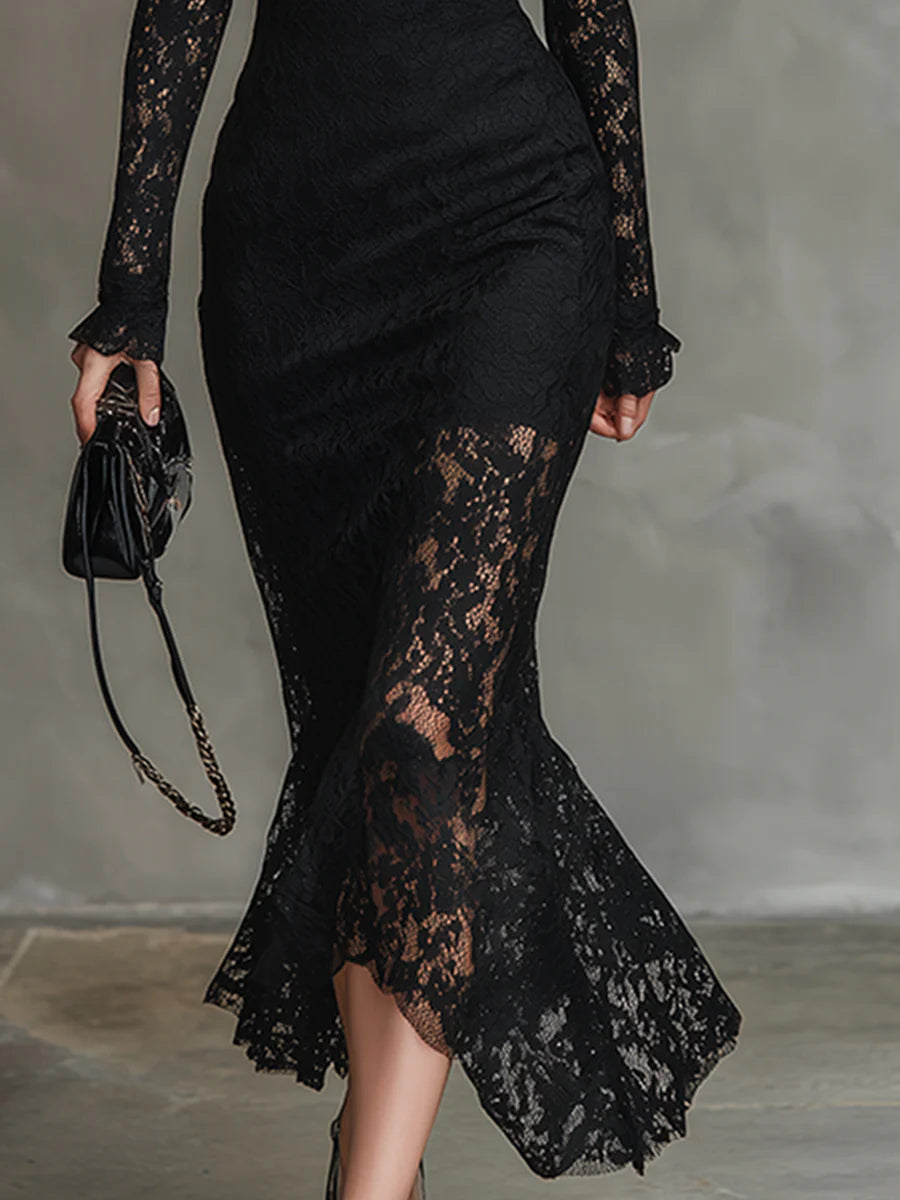Black lace maxi dress named Julia by THE WHITMORE FAMILY, featuring elegant lace fabric and a flowing silhouette.