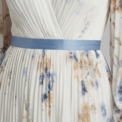Lavinia long sleeve V-neck floral maxi dress by THE WHITMORE FAMILY, featuring a flowing silhouette and vibrant floral pattern.