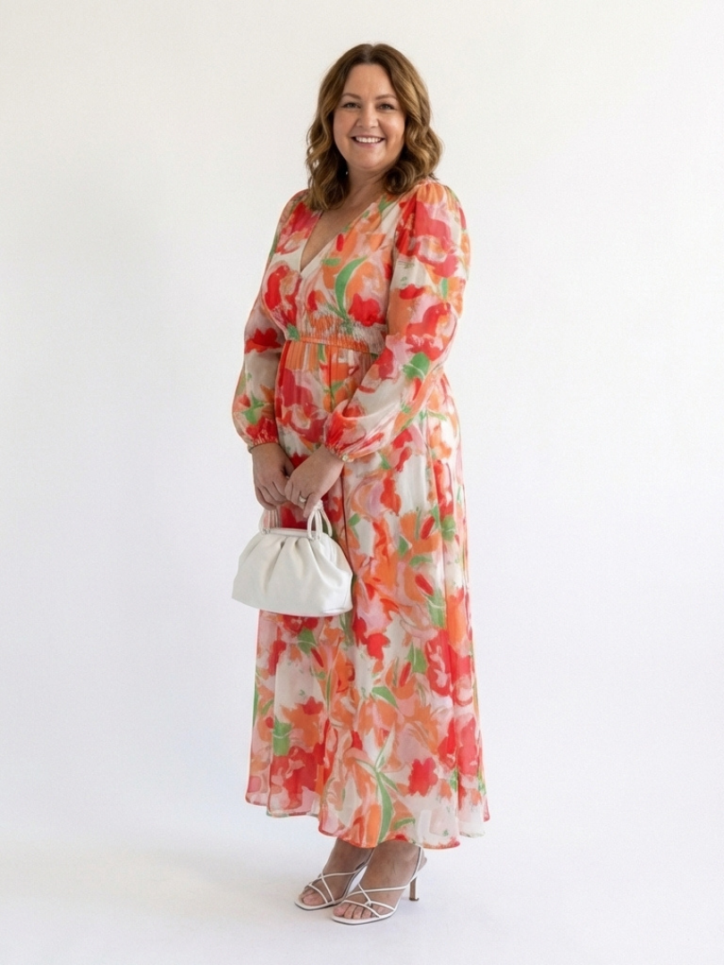 Althea long sleeve floral maxi dress by THE WHITMORE FAMILY featuring a flowing silhouette and vibrant floral pattern.