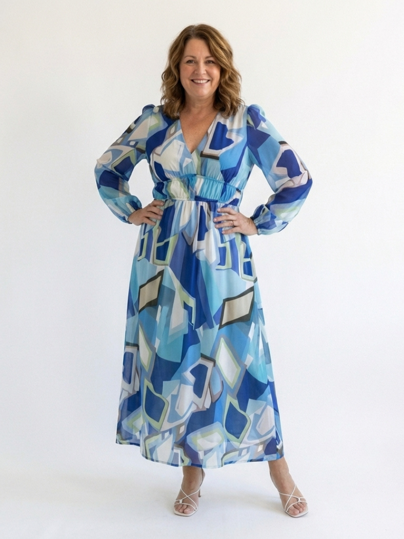 Long sleeve floral maxi dress from THE WHITMORE FAMILY featuring a flowing silhouette and vibrant floral pattern.
