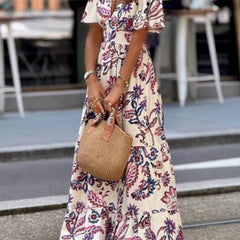 Purple floral print Joan maxi dress by THE WHITMORE FAMILY featuring puff sleeves and a flowing silhouette.