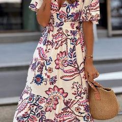 Purple floral print Joan maxi dress by THE WHITMORE FAMILY featuring puff sleeves and flowing fabric.