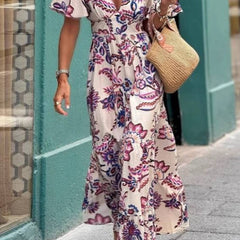 Purple floral print Joan maxi dress by THE WHITMORE FAMILY featuring puff sleeves and a flowing silhouette.
