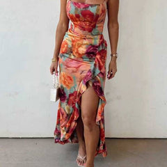 Red floral backless satin maxi dress by THE WHITMORE FAMILY featuring a flowing silhouette and elegant design.