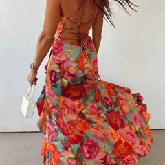 Red floral backless satin maxi dress by THE WHITMORE FAMILY, flowing elegant design with a fitted waist and sleeveless style.