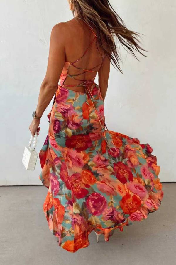 Red floral backless satin maxi dress by THE WHITMORE FAMILY, flowing elegant design with a fitted waist and sleeveless style.