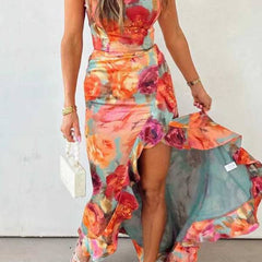 Red floral backless satin maxi dress by THE WHITMORE FAMILY, flowing design with elegant straps and a sophisticated style.