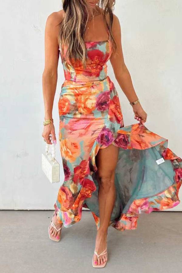 Red floral backless satin maxi dress by THE WHITMORE FAMILY, flowing design with elegant straps and a sophisticated style.