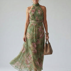 Naomi halter maxi dress by THE WHITMORE FAMILY, featuring a gathered halter neckline and flowing silhouette.