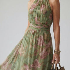 Naomi halter maxi dress by THE WHITMORE FAMILY featuring a gathered bodice and flowing silhouette, shown in a natural fabric.