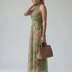 Naomi halter maxi dress by THE WHITMORE FAMILY, featuring gathered fabric and a flowing silhouette, shown in a quiet statement style.