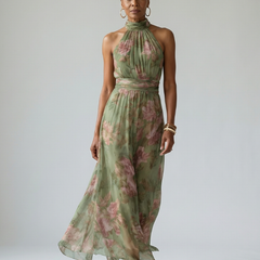 Naomi halter maxi dress by THE WHITMORE FAMILY, flowing fabric, sleeveless design, and elegant silhouette in a vibrant color.