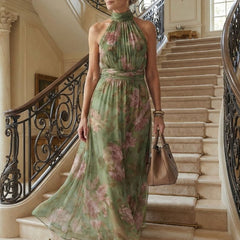 Naomi halter maxi dress by THE WHITMORE FAMILY featuring a gathered bodice, flowing fabric, and elegant maxi length.