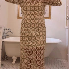 Beige Judy floral long sleeve midi dress by THE WHITMORE FAMILY, featuring a fitted waist and elegant midi length.