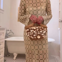 Beige floral long-sleeve midi dress by THE WHITMORE FAMILY, featuring a fitted waist and elegant midi length.
