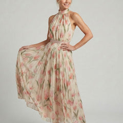 Aurelle halter neck floral midi dress by THE WHITMORE FAMILY, featuring a fitted bodice and flowing skirt with vibrant floral print.
