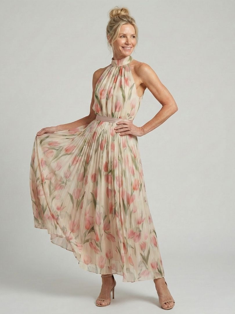 Aurelle halter neck floral midi dress by THE WHITMORE FAMILY, featuring a fitted bodice and flowing skirt with vibrant floral print.