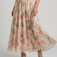 Aurelle halter neck floral midi dress by THE WHITMORE FAMILY, featuring a fitted bodice and flowing skirt with vibrant floral pattern.