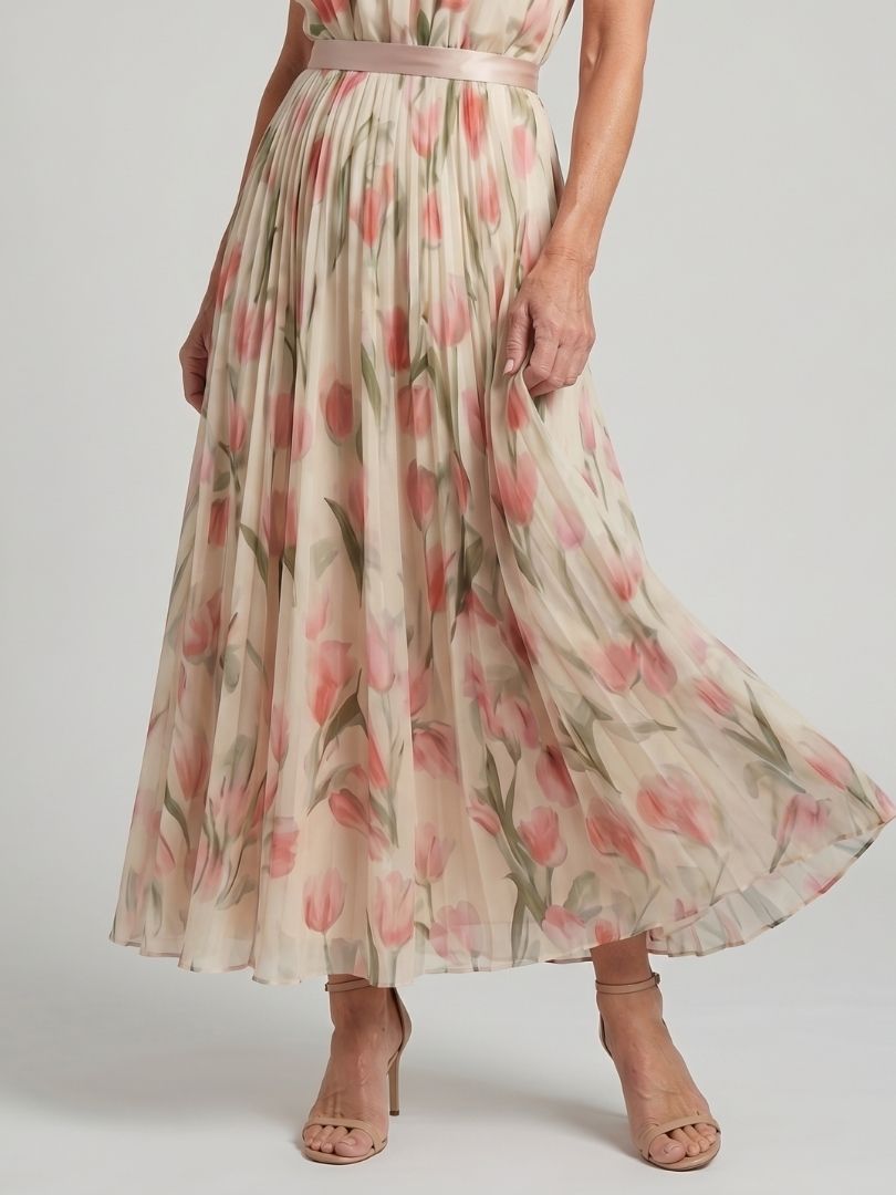 Aurelle halter neck floral midi dress by THE WHITMORE FAMILY, featuring a fitted bodice and flowing skirt with vibrant floral pattern.