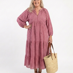 Arlette geometric print long sleeve midi dress by THE WHITMORE FAMILY, featuring a stylish pattern and elegant midi length.