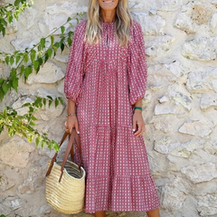 Arlette geometric print long sleeve midi dress by THE WHITMORE FAMILY, featuring a stylish geometric pattern and fitted silhouette.