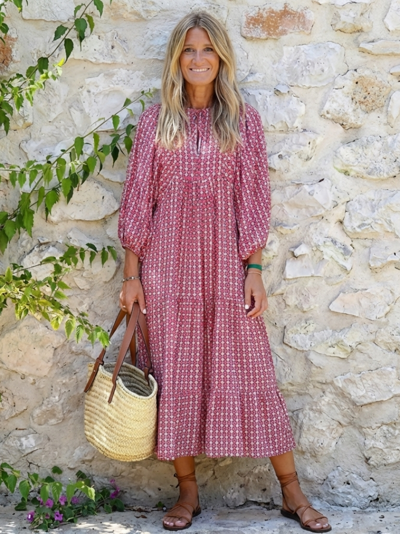 Arlette geometric print long sleeve midi dress by THE WHITMORE FAMILY, featuring a stylish geometric pattern and fitted silhouette.