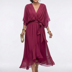Elysia V-neck draped waist tie midi dress by THE WHITMORE FAMILY, featuring a flowing silhouette and elegant draping.