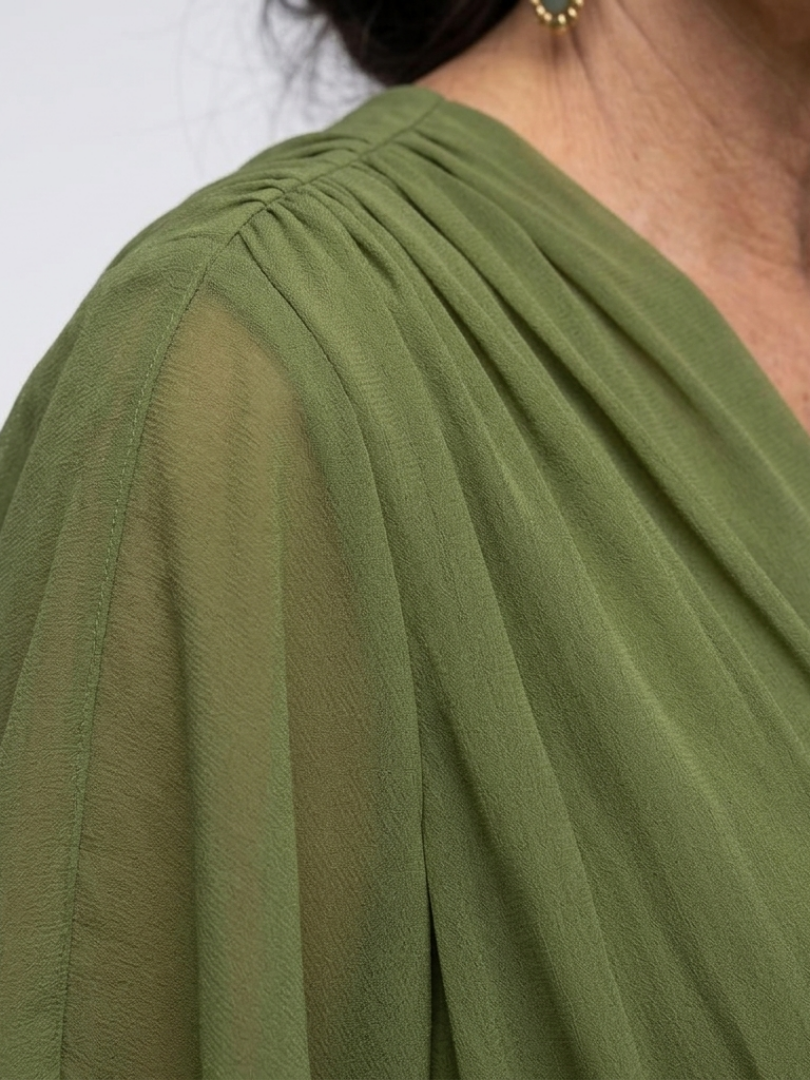 Elysia V-neck midi dress by THE WHITMORE FAMILY featuring a draped waist tie and flowing fabric in a stylish design.
