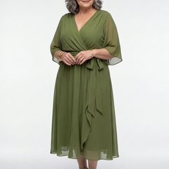 Elysia V-neck draped waist tie midi dress by THE WHITMORE FAMILY, featuring a flowing silhouette and elegant design.