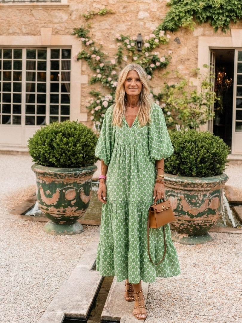 A patterned midi dress with three-quarter sleeves and a V-neck, styled in a relaxed fit from THE WHITMORE FAMILY Apolline collection.
