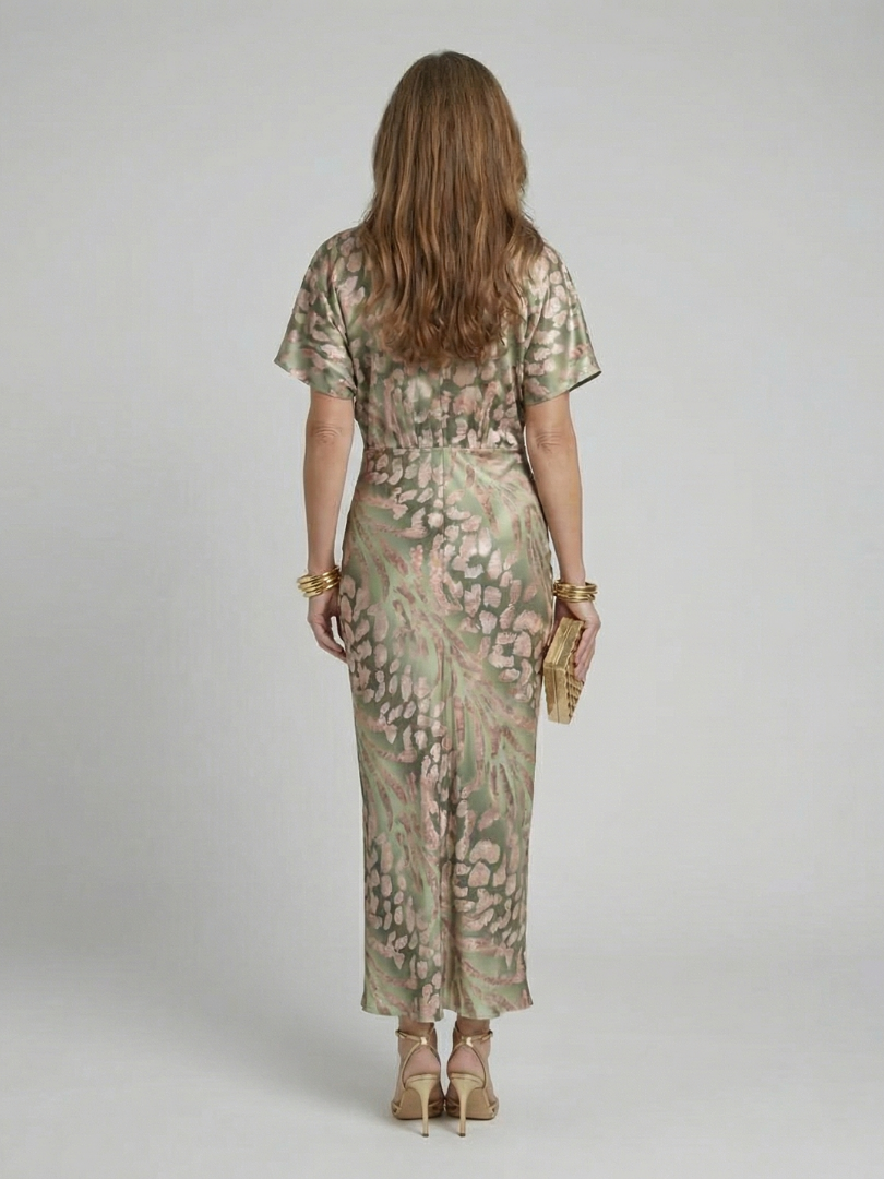Coralie abstract print V-neck twist waist midi dress by THE WHITMORE FAMILY, featuring a stylish design and elegant silhouette.