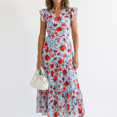 Lila floral V-neck tiered midi dress by THE WHITMORE FAMILY, featuring a flowy silhouette and vibrant floral pattern.