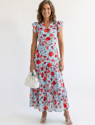 Lila floral V-neck tiered midi dress by THE WHITMORE FAMILY, featuring a flowy silhouette and vibrant floral pattern.