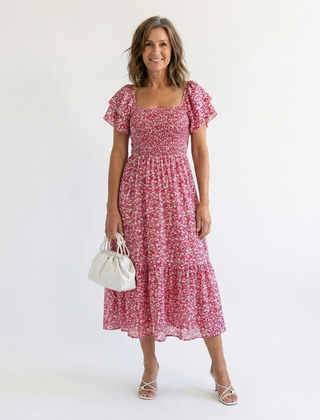 Odette off-shoulder floral smocked midi dress by THE WHITMORE FAMILY, featuring a flowy silhouette and feminine floral print.