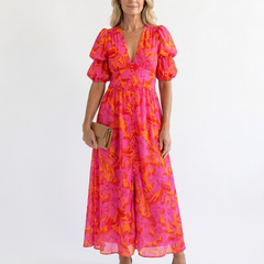 Willow floral V-neck puff sleeve midi dress by THE WHITMORE FAMILY, featuring a fitted waist, V neckline, and puff sleeves.