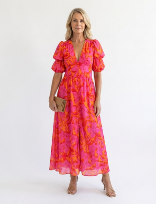 Willow floral V-neck puff sleeve midi dress by THE WHITMORE FAMILY, featuring a fitted waist, V neckline, and puff sleeves.