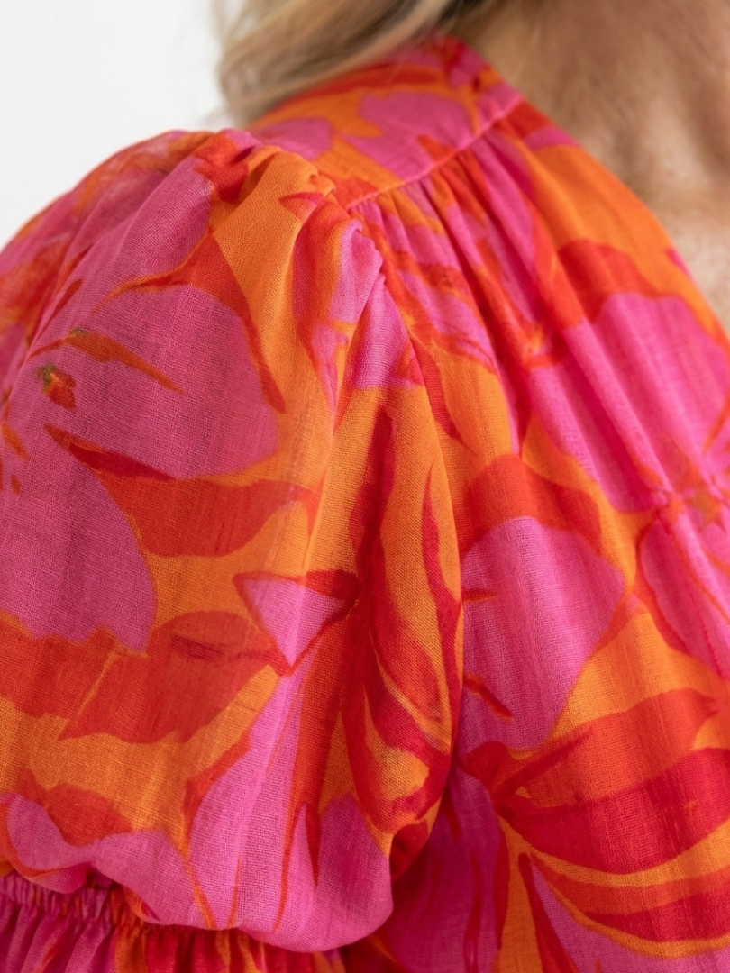 Willow floral V-neck puff sleeve midi dress by THE WHITMORE FAMILY, featuring a flowing midi length and floral pattern.