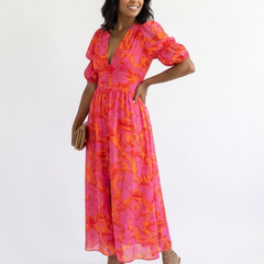 Willow floral V-neck puff sleeve midi dress by THE WHITMORE FAMILY, featuring a feminine floral pattern and elegant midi length.